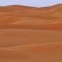 Prayer - Erg Chebbi dune landscape, Morocco